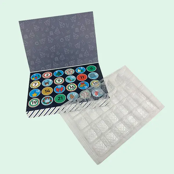 Custom chocolate advent calendar box with transparent blister tray insert Image Title: Chocolate Advent Calendar Box with Blister Tray