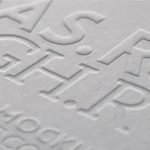Emboss and deboss effect on chocolate packaging with textured paper finish